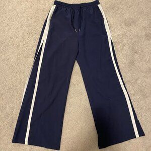 Navy blue and white track pants